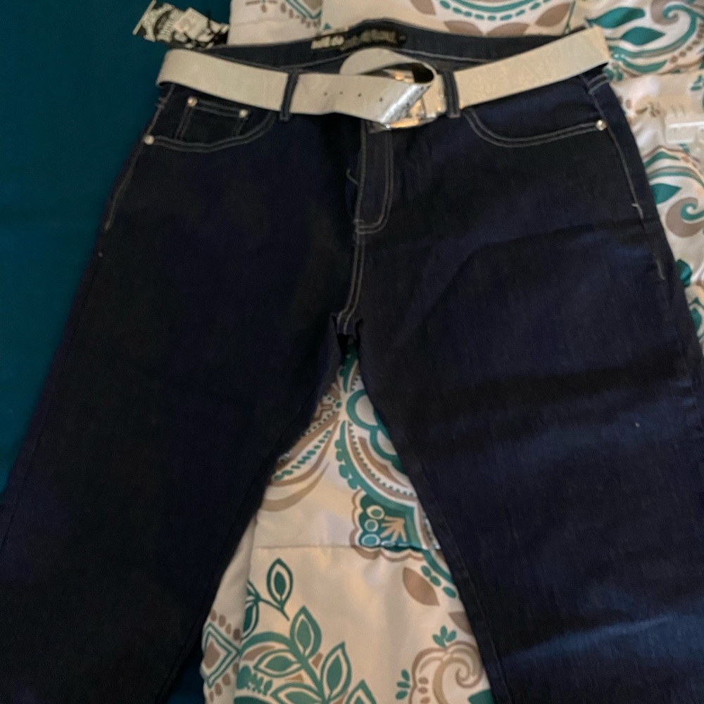 Cute dark blue Jean capris with attached belt.